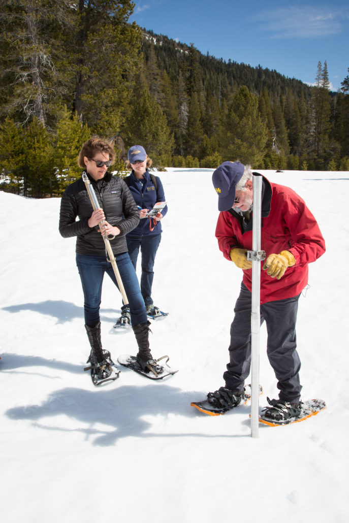 Karla Nemeth, Director of the California Department of Water Resources, left, Cindy Messer, Chief Deputy Director (DWR), center, assists Frank Gehrke, Chief of the California Cooperative Snow Surveys Program, with the fourth snow survey of 2018 at Phillips Station in the Sierra Nevada Mountains. The survey site is approximately 90 miles east of Sacramento off Highway 50 in El Dorado County. Photo: Dale Kolke / California Department of Water Resources low snowpack