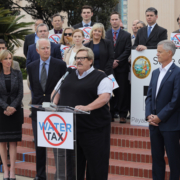 Water Authority Chairman Mark Muir (center) speaks to reporters at a news conference of regional leaders announcing their opposition to a proposed state water tax. Photo: Water Authority