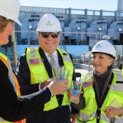 L to R: Water Authority Deputy General Manager Sandra Kerl, Poseidon Water CEO Carlos Riva, and former Senator Barbara Boxer share a toast at Thursday's third anniversary event at the Carlsbad desalination plant. Photo: Water Authority