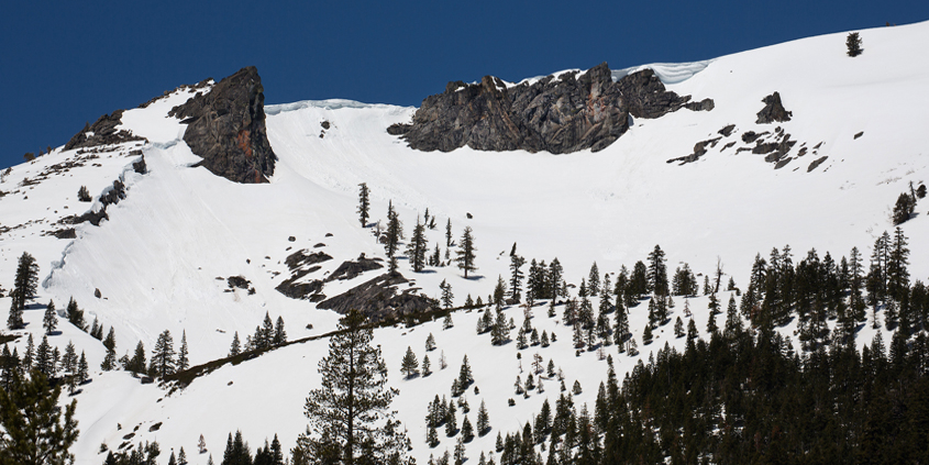 A snow-covered Sierra Nevada Mountain peak to the northwest from the Phillips Station meadow season. Photo: Dale Kolke / California Department of Water Resources snowmelt