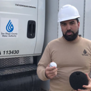 Water Resources Engineer Sami Sweis holds the Nautilus in his right hand and a foam ball in his left hand that the high-tech device is placed in before it is inserted into a water pipeline to scan for potential leaks. Photo: Water Authority