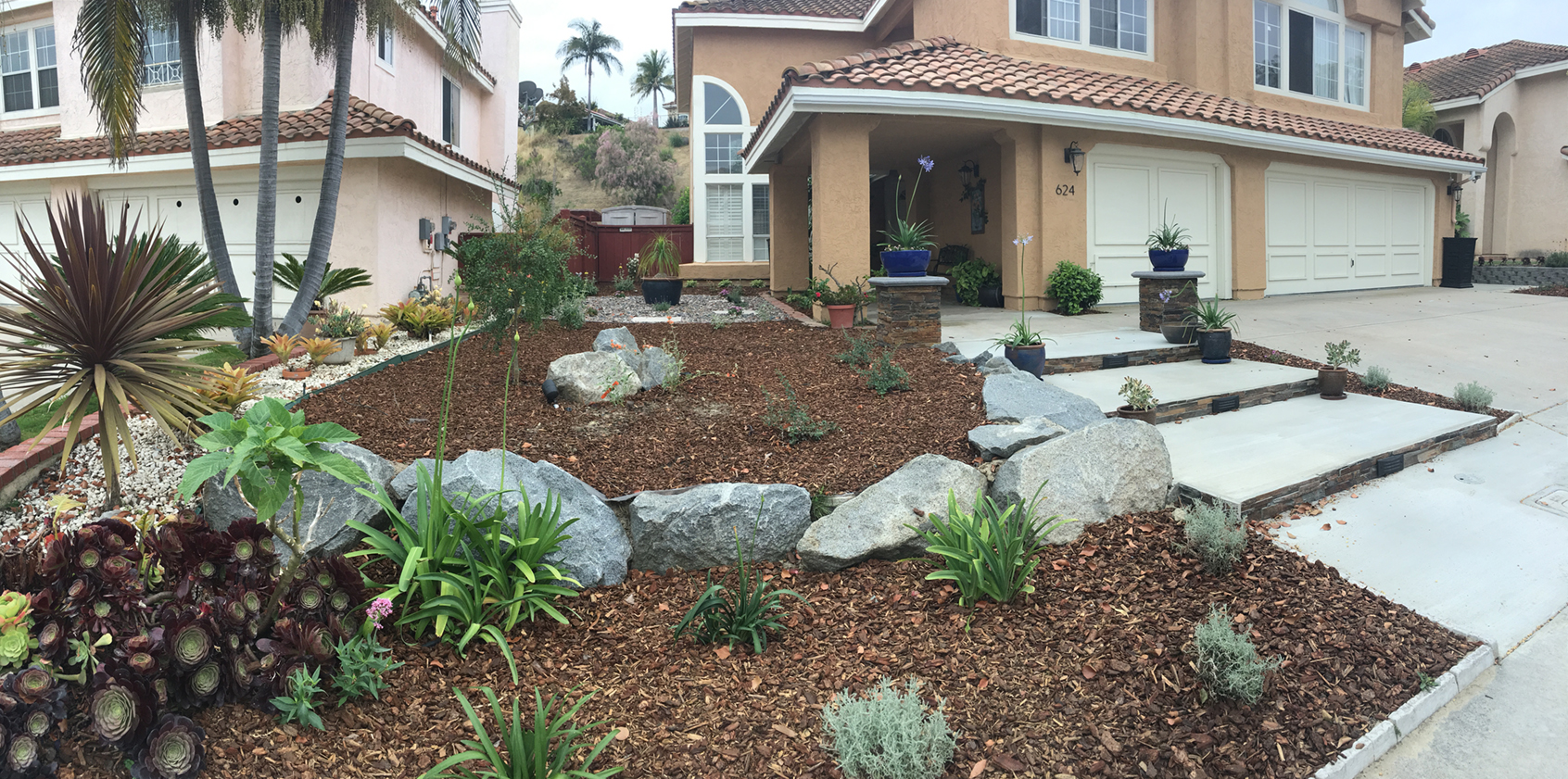 Boulders can add points of interest and slow down water runoff in your landscaping. Photo: Water Authority