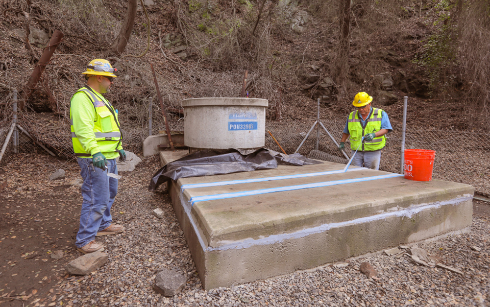 Crews complete work on and seal the top of a bifurcation structure. Photo: Water Authority