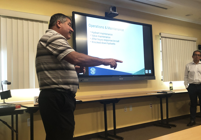 Sweetwater Authority Director of Distribution Greg Snyder (left) and Engineering Manager Luis Valdez train National City firefighters at Station 34. Photo: Courtesy Sweetwater Authority