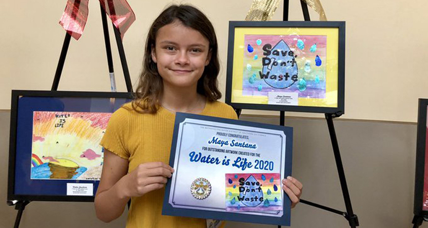 Calendar poster contest winner Maya Santana, a fifth grader from Wolf Canyon Elementary School in the Otay Water District, displays her winning artwork. Photo: Otay Water District Water Is Life Calendar