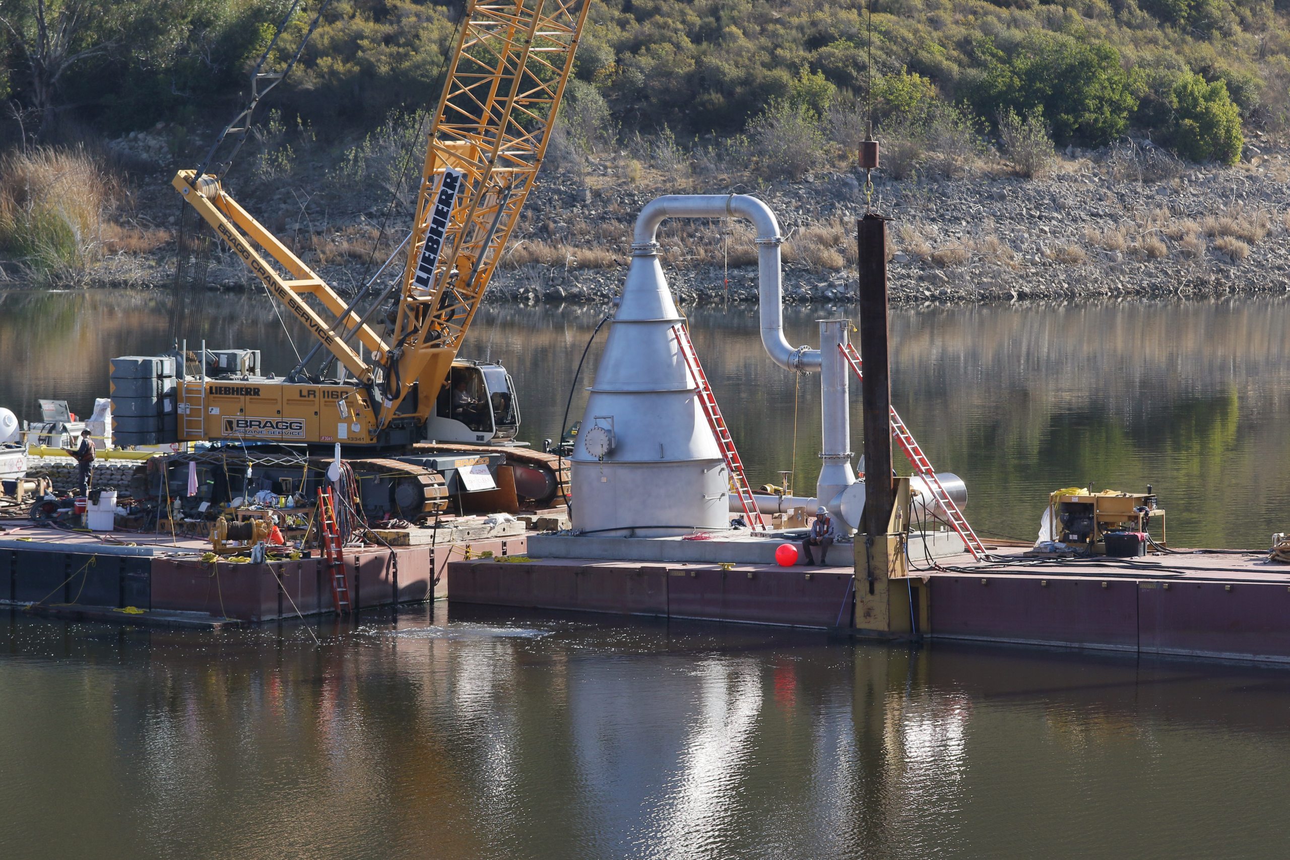 Now underwater, the cone will distribute oxygen-rich water throughout the reservoir to reduce the accumulation of excess nutrients and prevent harmful algae growth. Image: Water Authority