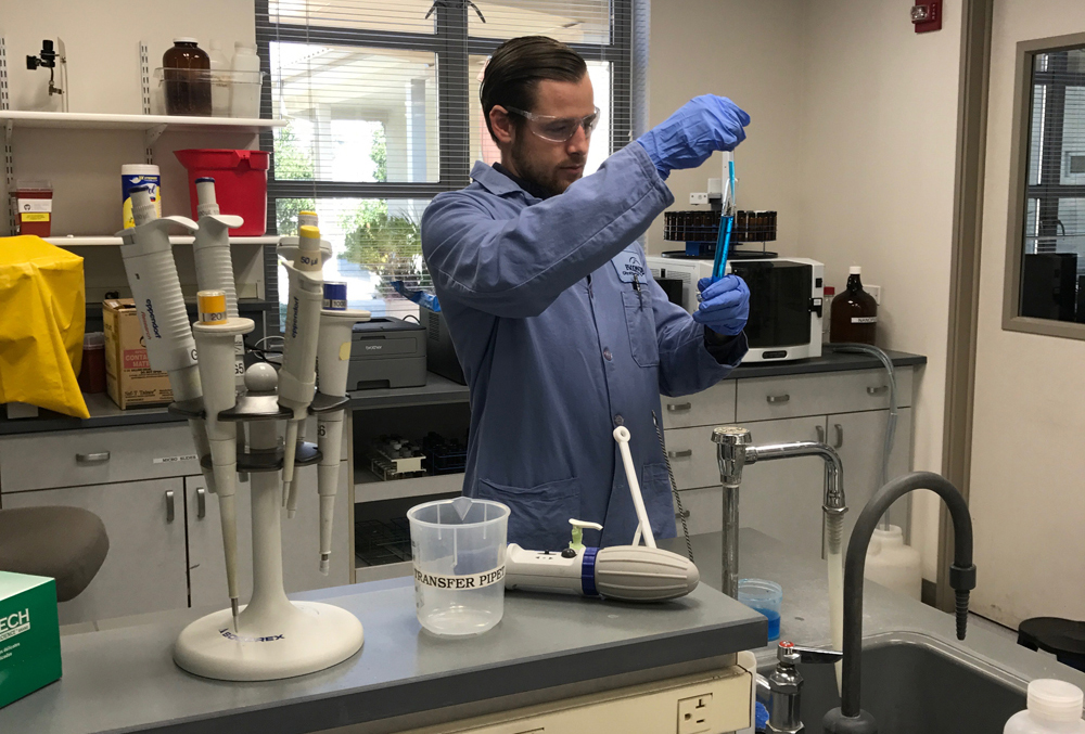 Brett Kelley conducts a test in the City of Escondido Water Quality Lab. Photo: City of Escondido