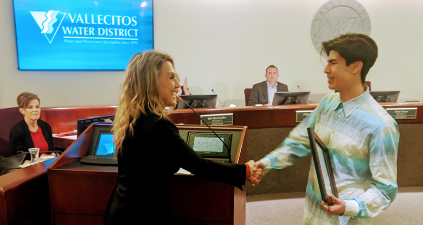 San Marcos Mayor Rebecca Jones presents winner Jordan Chan with a certificate of appreciation at the Vallecitos Water District's February board meeting. Photo: VWD
