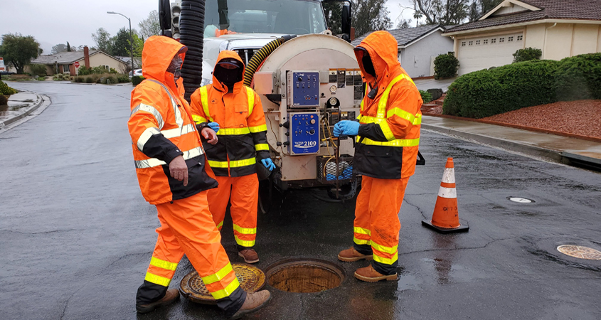 (L to R): Terry Zaragoza, Chad Weigel and Vernon Fitzpatrick from the City of Poway perform routine maintenance on a wastewater pipeline as essential employees. Photo: City of Poway