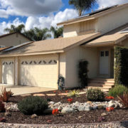 Vibrant pink, orange, purple and red succulents are interspersed among lush rosemary and lavender bushes in this award-winning landscape makeover in Santee. Photo: Padre Dam MWD