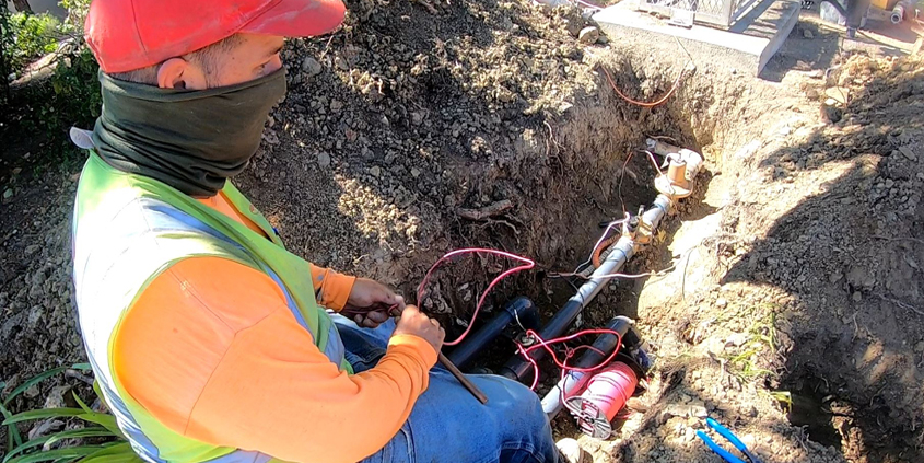 Brian Idekler of O'Connell Landscape Maintenance installs a flow control sensor for the San Elijo HOA. Photo: Vallecitos Water District