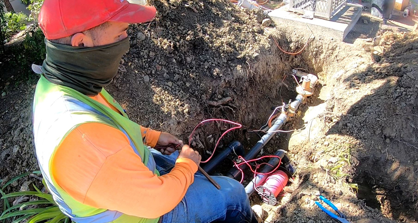 Brian Idekler of O'Connell Landscape Maintenance installs a flow control sensor for the San Elijo HOA. Photo: Vallecitos Water District