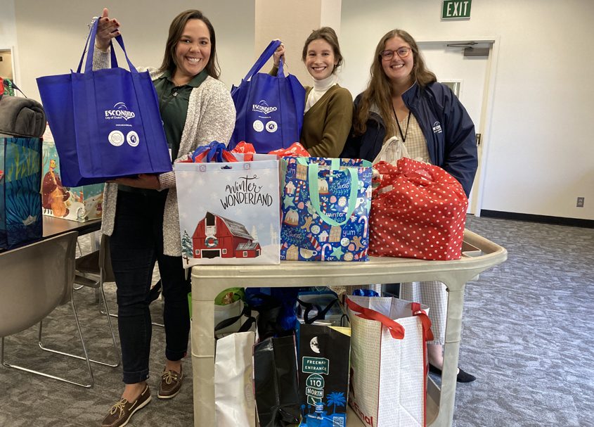 Environmental Programs/Utilities employees dropping off donations for this year’s employee holiday drive. City of Escondido Environmental Programs/Utilities employees drop off donations for this year’s holiday drive.(L to R): Marielle Decker, Emily Mixer, Sawyer Epp. Photo: City of Escondidov