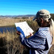 Naturalists Paige DeCino (left) and Karen Merrill survey South Lake Reservoir. Photo: Vallecitos Water District