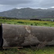 An employee looks into a section of pipeline. One of the projects receiving an award.