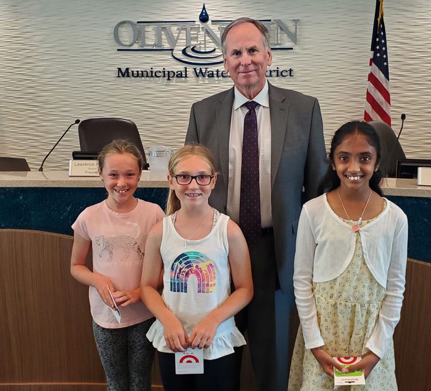 Larry A. Watt, OMWD Board President (center) with contest winners (left to right) Ariana Lemle, Emalyn Negrea, and Indira Jayanti. Photo: Olivenhain Municipal Water Districtv