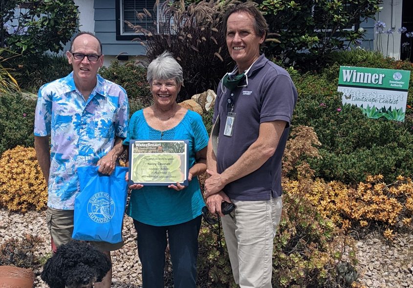 Clay Clifton, Sweetwater Authority Program Specialist, presents the Cavanahs their award. Their landscape was selected from a diverse pool of applicants as the best example of how to create a beautiful landscape using less water. Photo: Sweetwater Authority