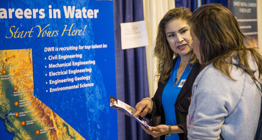 California Dept. of Water Resources staff services manager Norma Alvarado talks with students at a water industry career fair showcasing a broad array of options. Photo: Kelly M. Grow, California Department of Water Resources waterworks management degree