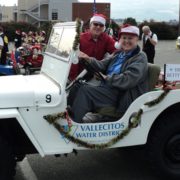 History on wheels rolls into the Vallecitos Water District when a 1947 Jeep becomes a museum display named for longtime board member Betty Ferguson. Ferguson is behind the wheel at the 2010 San Marcos Christmas Parade. Photo: Vallecitos Water District