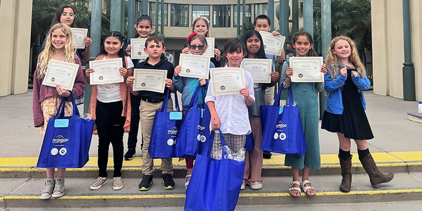 Winning artists in the 2023 Escondido Student Poster Art Contest. Front Row L-R: Annabella Trecha, Aysha Navarrete, Wyatt Hada, Avery Smith, Lincoln Steele, Belen Rios Perez, Avery Salazar, Amelia Scroggy. Back Row L-R: Aria Manoocheri, Andrea Garcia, Cassie Goodwin, Isaac Holsclaw. Photo: City of Escondido