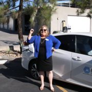 Helix Water District Board President Kathleen Coates Hedberg poses with one of the district's electric Prius service vehicles at a charging station. Photo: Helix Water District Water energy leader