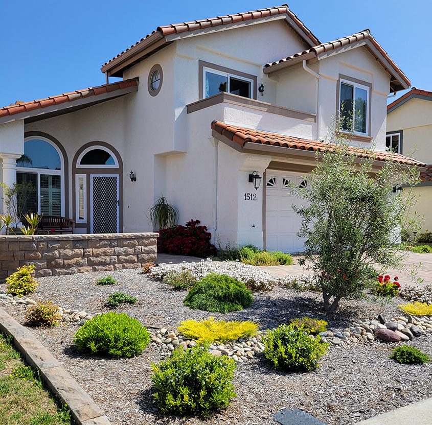 The landscape makeover replaced grass with new low water use plants and a patio area. Photo: Vista Irrigation District landscape