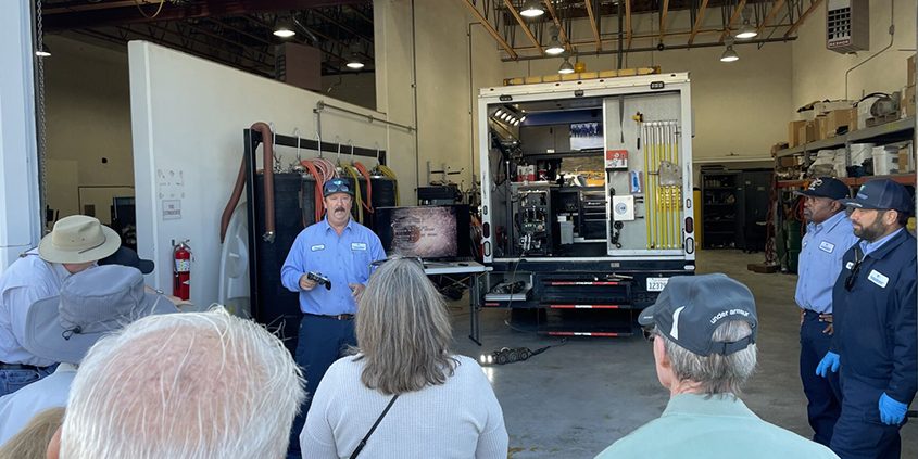 Wastewater Collection System Worker II Jesse Halbig explain how the crew put a remote camera into the sewer system to inspect the condition of the sewer pipes. Photo: Vallecitos Water District Water Academy