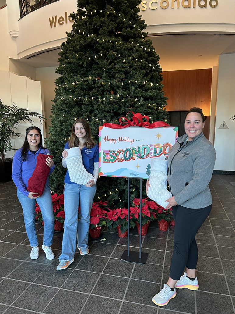 (L to R) City of Escondido Environmental Programs team members Marielle Decker, Emily Mixer, and Janin Rodarte share the holiday spirit. Photo: City of Escondido holiday giving