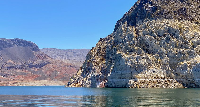 Low water conditions reveal the light-colored rink traces along the rock-wall shoreline at Lake Mead, showing the decreased water level from years of drought conditions in the Colorado River basin. Innovative water sharing agreements can help to mitigate this. Photo: Christopher Clark / U.S. Department of the Interior - Bureau of Reclamation