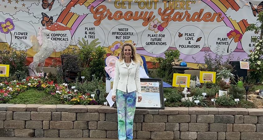 Specialist Debby Dunn poses with her "Groovy Garden" exhibit at the San Diego County Fair. Photo: Debby Dunn speakers list