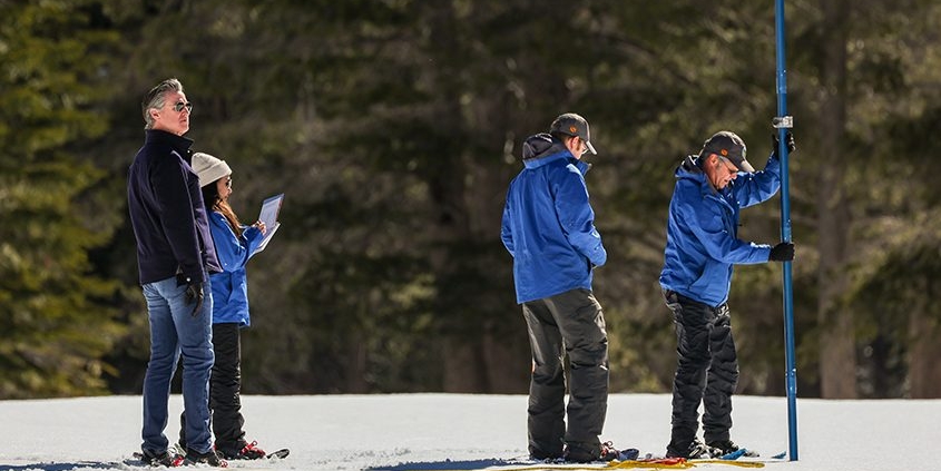 (Left to right) California Dept. of Water Resources Director Karla Nemeth, California Natural Resources Agency Secretary Wade Crowfoot and Gov. Gavin Newsom join the snow survey team for fourth media snow survey of the 2024 season is held at Phillips Station in the Sierra Nevada. The survey is held approximately 90 miles east of Sacramento off Highway 50 in El Dorado County. Photo:  Andrew Nixon, California Dept. of Water Resources