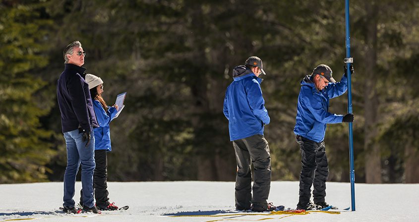 (Left to right) California Dept. of Water Resources Director Karla Nemeth, California Natural Resources Agency Secretary Wade Crowfoot and Gov. Gavin Newsom join the snow survey team for fourth media snow survey of the 2024 season is held at Phillips Station in the Sierra Nevada. The survey is held approximately 90 miles east of Sacramento off Highway 50 in El Dorado County. Photo:  Andrew Nixon, California Dept. of Water Resources