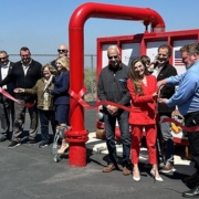 Left group, front row: San Marcos councilmembers Ed Musgrove and Mike Sannella; San Marcos Deputy Mayor Sharon Jenkins; San Marcos Mayor Rebecca Jones. Back row: San Marcos Fire Department Fire Marshall/Battalion Chief Jason Nailon. Right group, front row: Vallecitos Board Member Craig Elitharp and President Tiffany Boyd-Hodgson, Ph.D.; Vallecitos Operations and Maintenance Manager Ed Pedrazzi. Back row: Vallecitos Board Member Jim Pennock with grandson; Vallecitos Board Member Erik A. Groset, Vallecitos General Manager James Gumpel. Photo: Vallecitos Water District wildfire preparedness HeloPod