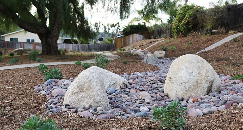 Dry riverbeds add interest and help manage stormwater runoff. Photo: MSE Landscape
