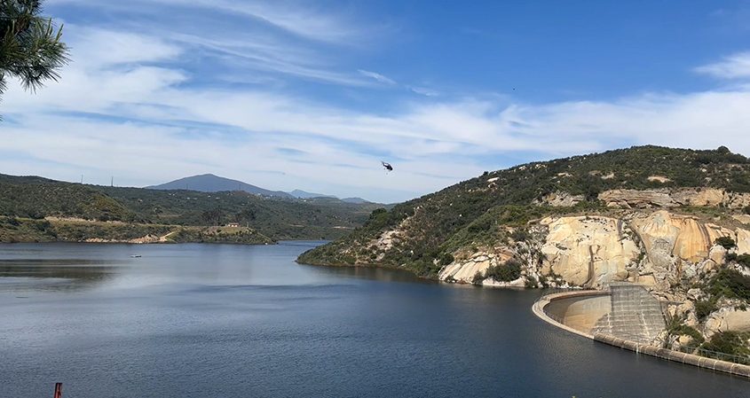 CalFIRE firefighting helicopter flies over Loveland Reservoir. Photo: Sweetwater Authority