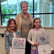 Poster contest winning artists Aria Drelich and Maia McAllum with OMWD Board President Christy Guerin. Photo: Olivenhain Municipal Water District