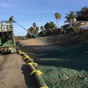Restoration efforts are making headway in Santee and Lakeside. This includes the use of hydroseeding - the spraying of a mulch type mixture with seeds and a binding agent in order to prevent erosion and protect the seeds. Photo: East County AWP