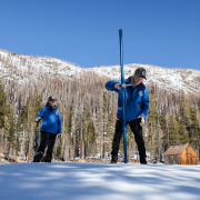 (L to R): California Department of Water Resources staff Angelique Fabbiani-Leon, State Hydrometeorologist; Jordan Thoennes, Water Resources Engineer; and Andy Reising, Snow Surveys and Water Supply Forecasting Unit Manager, conduct the third California snowpack survey of the 2025 season at Phillips Station in the Sierra Nevada. Photo: Xavier Mascareñas, California Department of Water Resources