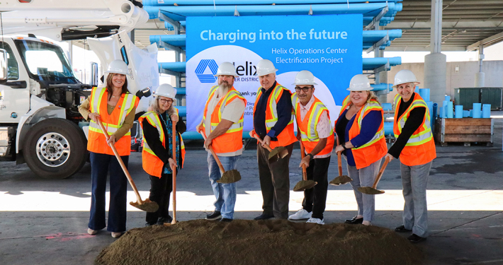 (L to R) SDG&E EV Customer Solutions Manager Lianna Lienau, Helix Division 2 Director Andrea Beth Damsky, Helix Board Vice President Joel A. Scalzitti, Helix Board President Dan McMillan, Helix Division 3 Director Mark Gracyk, Helix Division 4 Director Kathleen Coates Hedberg, and San Diego County Air Pollution Control District Chief of Emissions Reductions Kathleen Keehan at the groundbreaking for the Helix electrification project at its El Cajon operations center. Photo: Helix Water District