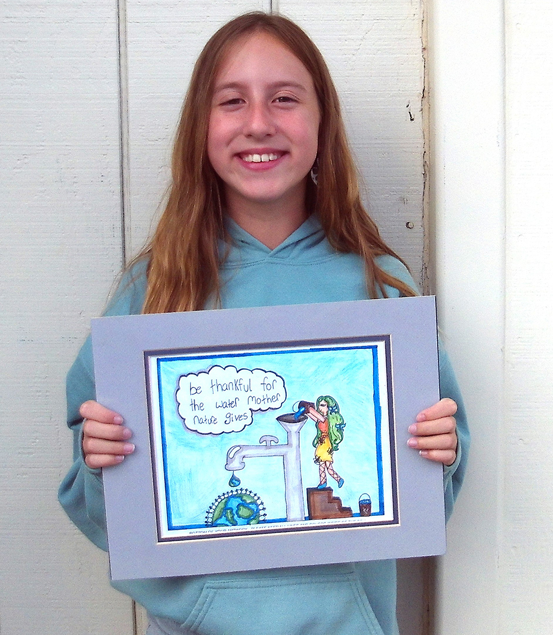Vista fourth grade student Brylee Burton-Arner displays her award winning poster contest entry. Photo: Vista Irrigation District