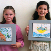 Vista fourth grade students Presley Regan and Cosette Kennedy display their award winning poster contest entries. Photo: Vista Irrigation District