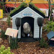 A doghouse with a green roof is one of the whimsical design elements in the award-winning "Groovy Garden" display at the 2025 San Diego County Fair Paul Ecke Jr. Garden Show. Photo: San Diego County Water Authority