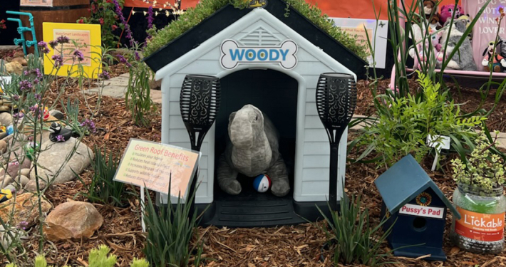 A doghouse with a green roof is one of the whimsical design elements in the award-winning "Groovy Garden" display at the 2025 San Diego County Fair Paul Ecke Jr. Garden Show. Photo: San Diego County Water Authority