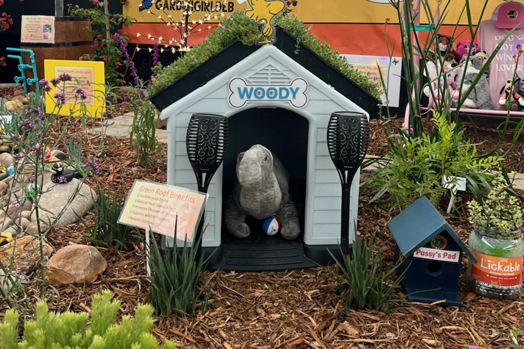 A doghouse with a green roof is one of the whimsical design elements in the award-winning "Groovy Garden" display at the 2025 San Diego County Fair Paul Ecke Jr. Garden Show. Photo: San Diego County Water Authority