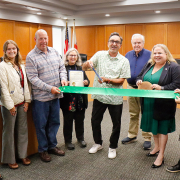 (L to R) Staff from the City of La Mesa and the U.S. Green Building Council of California (USGBC) present the Green Business Certification to Helix Water District's board of directors. From left: City of La Mesa's Hilary Ego and Lainey Bloom, USGBC's Robert Carr, Division 2 Director Andrea Beth Damsky, Division 3 Director Mark Gracyk, Board President Dan McMillan, Division 4 Director Kathleen Coates Hedberg, and City of La Mesa's Logan Kelly and Serena Lee. Photo: Helix Water District