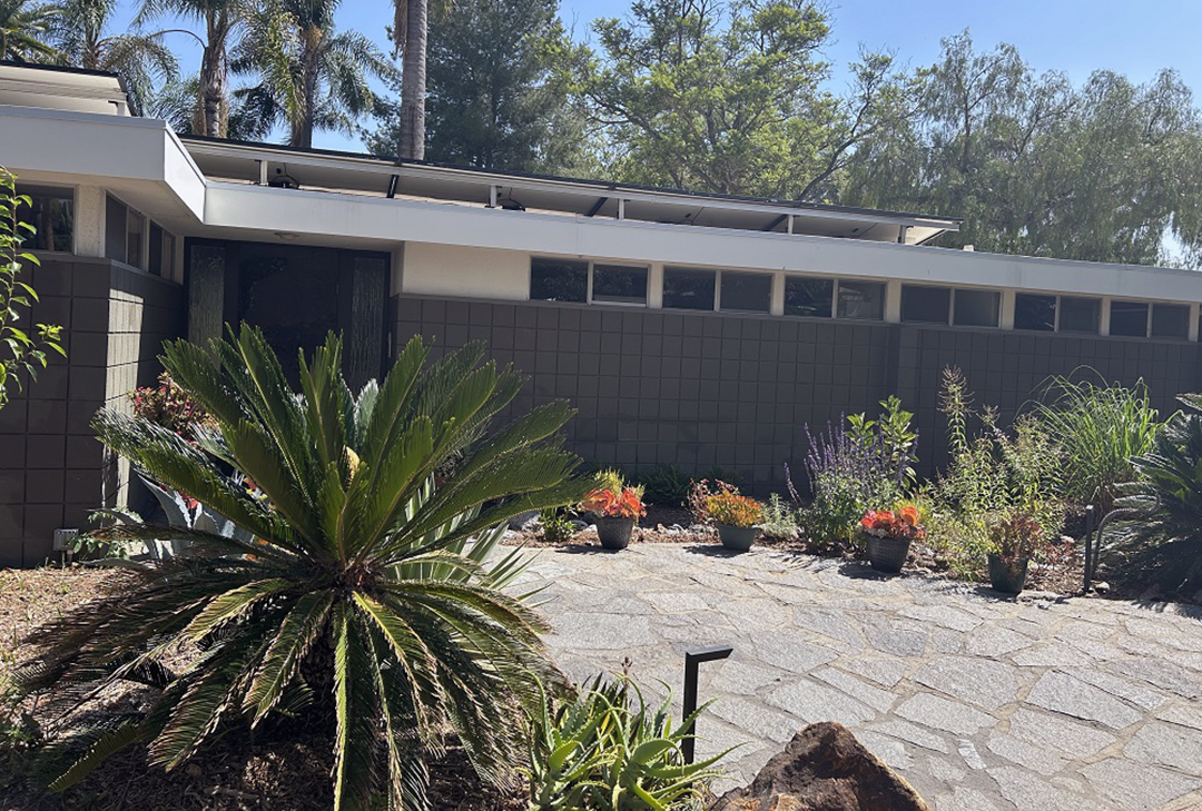 A separate graywater system for the front yard recycles wash water from the laundry room. Yannick placed rocks aboveground to mark the path of the graywater delivery pipes belowground, helping him to select the optimal spot for each new addition to the plant community. Photo: City of Escondido