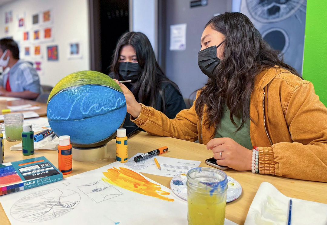 A Reason To Survive (ARTS) intern Addie E. works on the artwork titled "Mother Nature’s Conversion of Conservation" now installed at the Sweetwater Spigot. Photo: A Reason To Survive