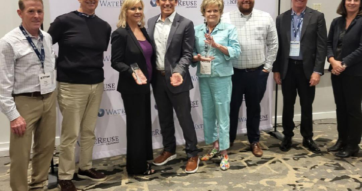 Representatives from the Olivenhain Municipal Water District, San Elijo Joint Powers Authority, and Leucadia Wastewater District accept their group award as 2025 WateReuse Association Outreach and Education Program of the Year award winner. Photo: Olivenhain Municipal Water District Water Career Day
