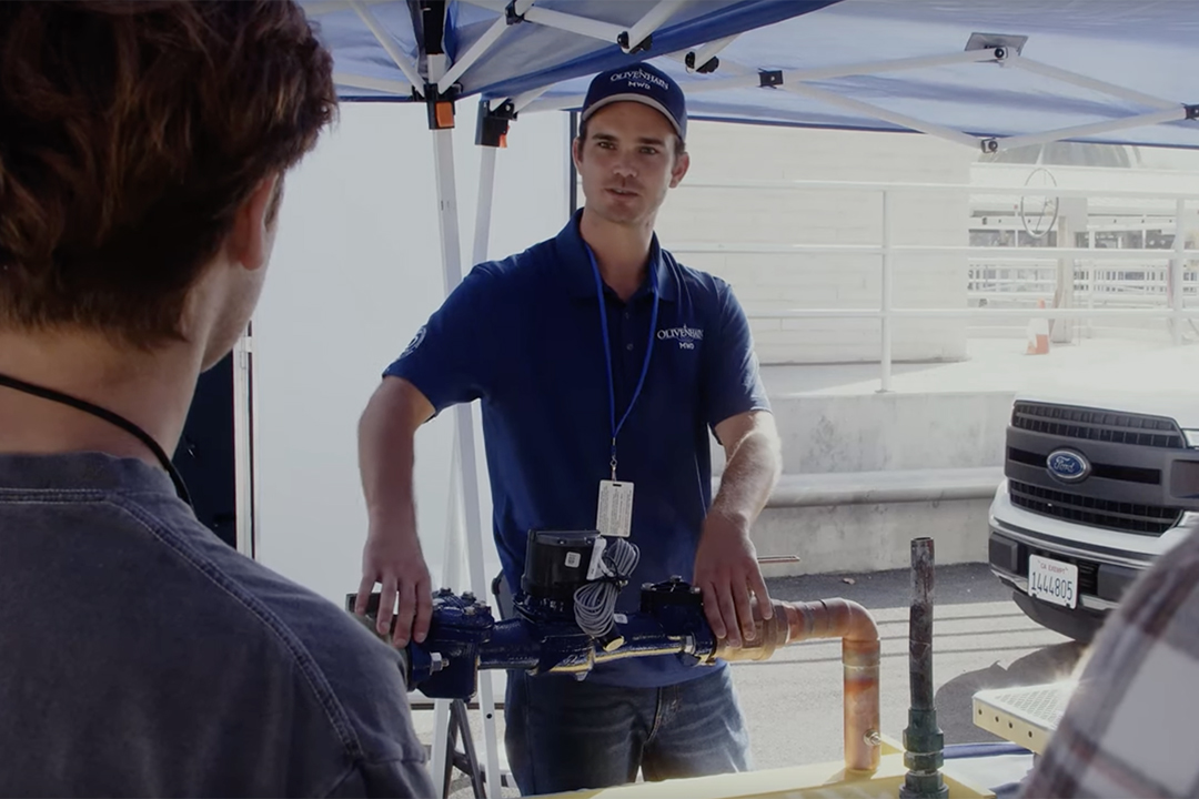 Olivenhain Municipal Water District Field Services Technician Morgan Ferguson demonstrates the type of tasks he performs as a water industry professional. Photo: Leucadia Wastewater District Education Water Career Day