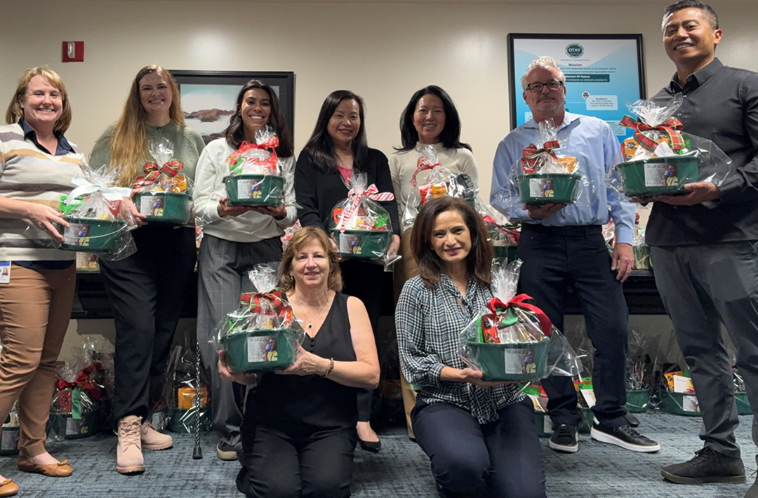 Otay Water District employees display some of the 200 baskets they assembled in support of Water for People fundraising this holiday season. Photo: Otay Water District